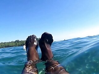 Crimson Toes And Stocking In The Sea